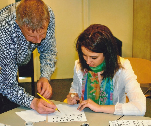 Teacher_and_a_young_woman_learning_calligraphy