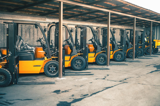 bigstock Background Of A Lot Of Forklif 237556981 - Square Cow Moovers