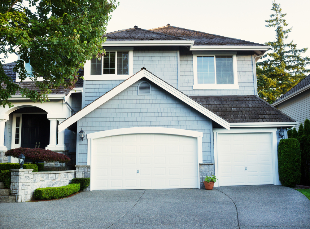 Front view of freshly painted home in summer during evening time