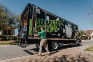 A man opening a door of a truck
