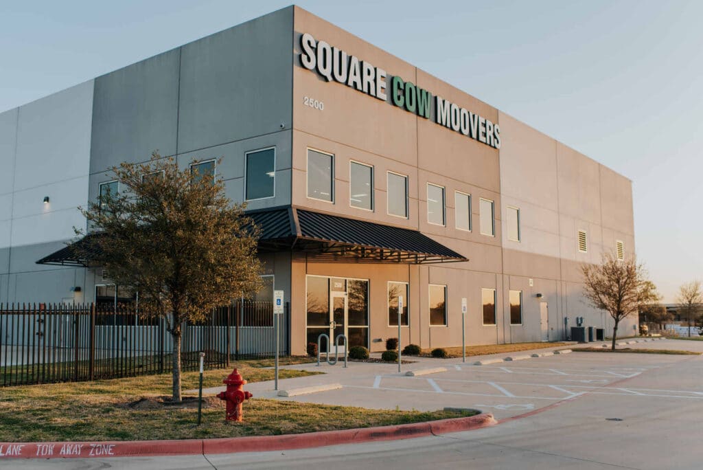 Square Cow Movers warehouse exterior with company sign