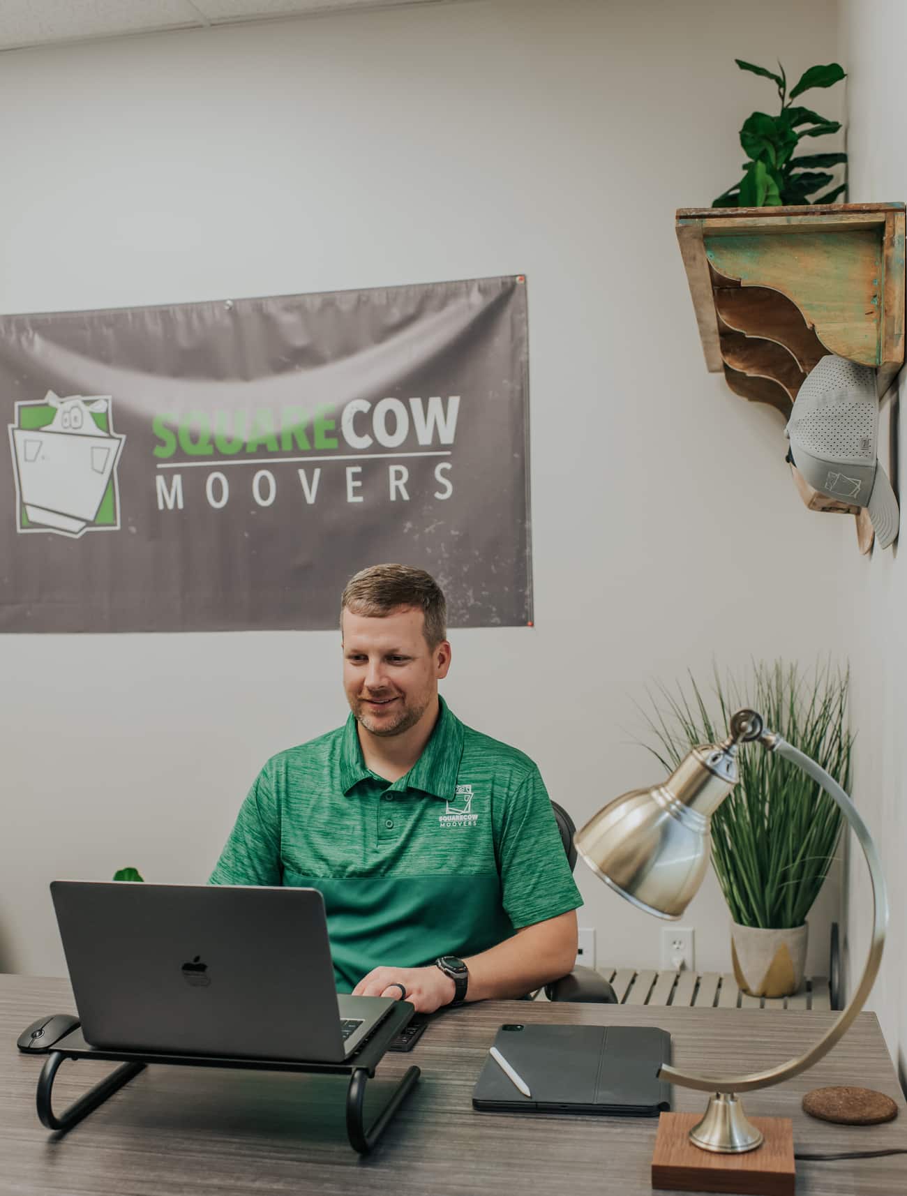 Square Cow Movers employee working on a laptop