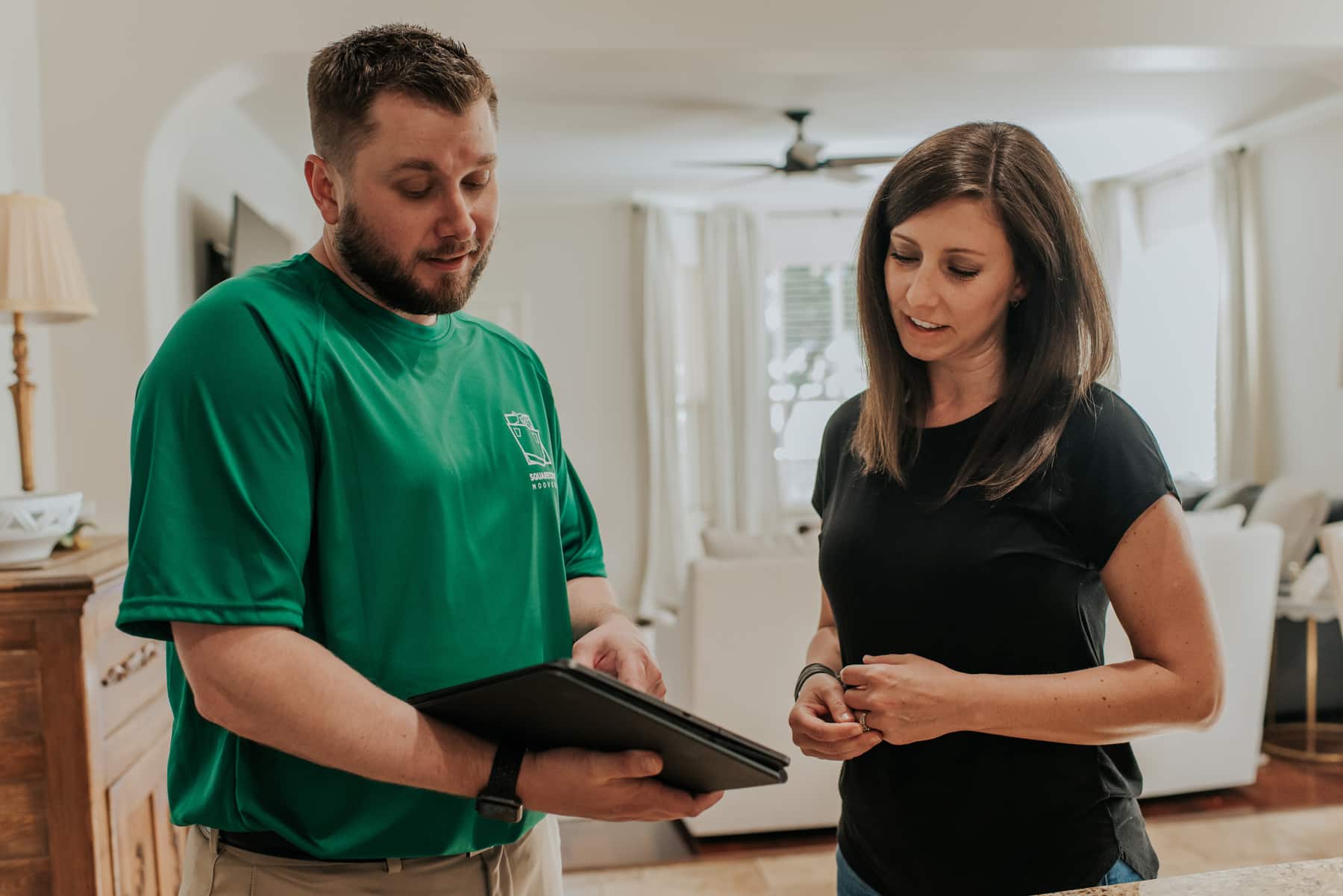 Square Cow Movers consultant reviewing a full-service moving estimate with a homeowner