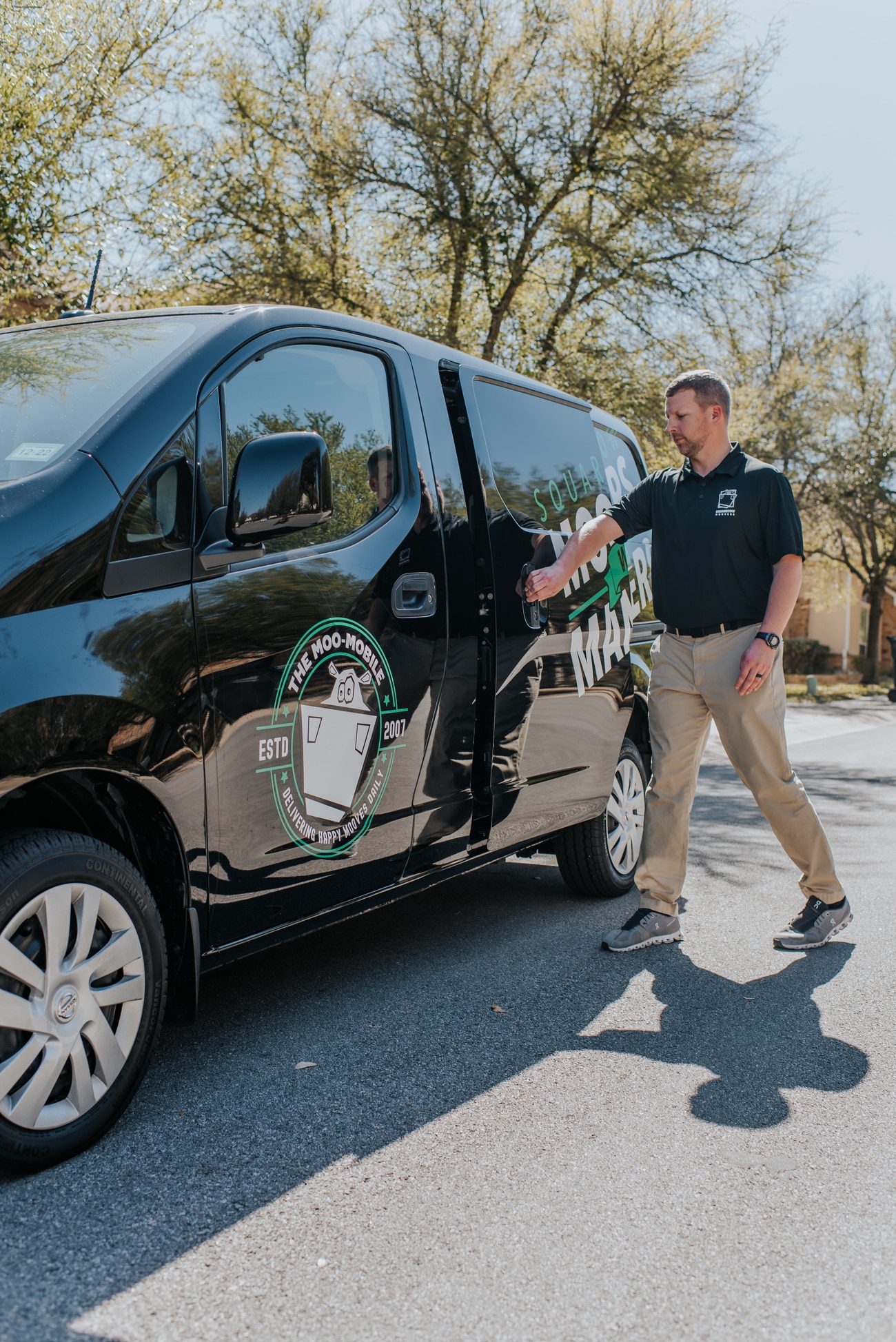 Square Cow Movers team member preparing to leave in a company vehicle for a move