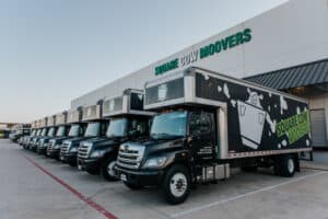 Square Cow Movers trucks lined up outside the company facility